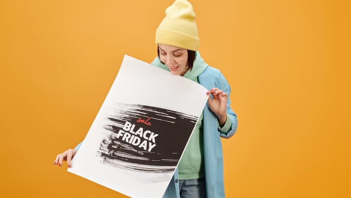 Woman holding a Black Friday banner