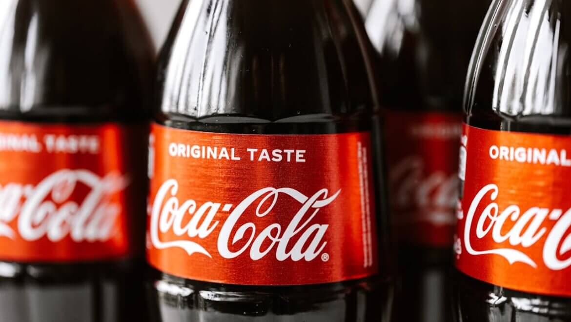 The iconic Coca-Cola logo featuring their custom typeface