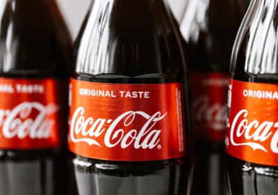 The iconic Coca-Cola logo featuring their custom typeface